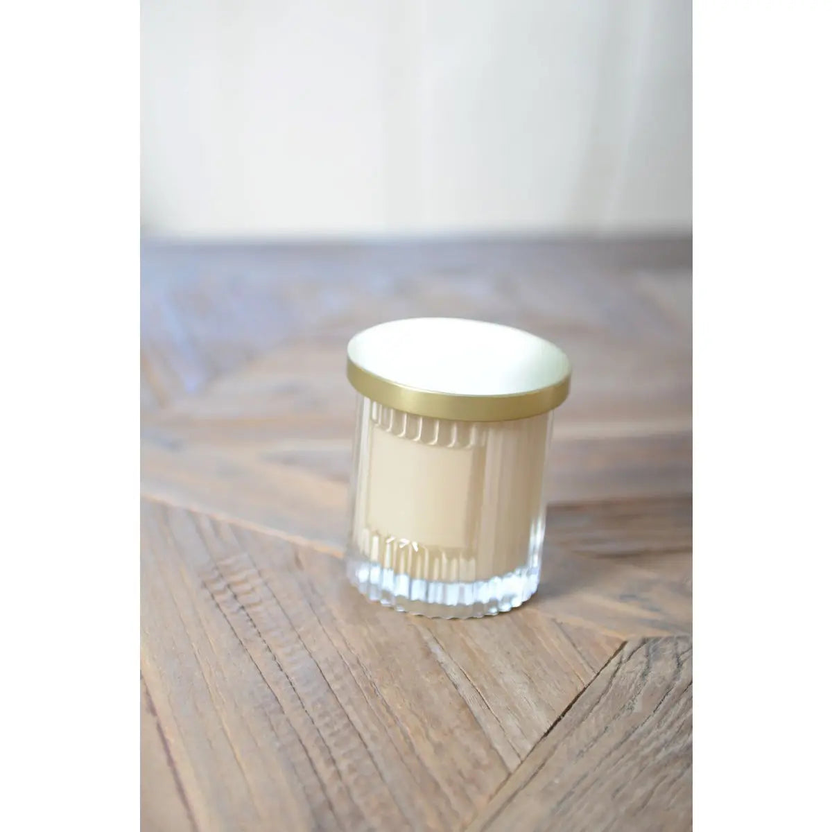 Bougie marron avec couvercle doré parfum coco AULICA
