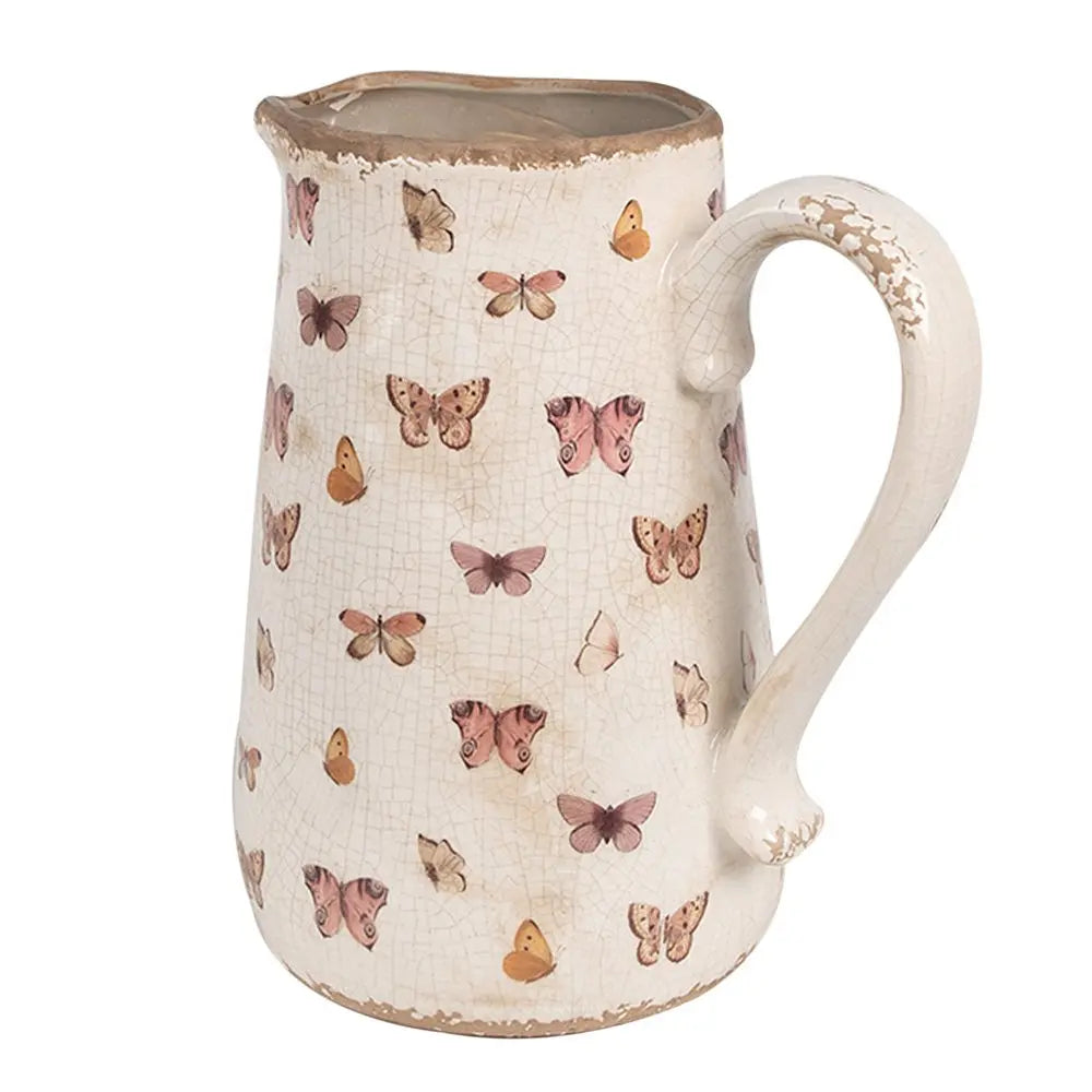 La décoration peut être de 21x15x23 cm de papillons en céramique rose beige verser la cruche Clayre & Eef.