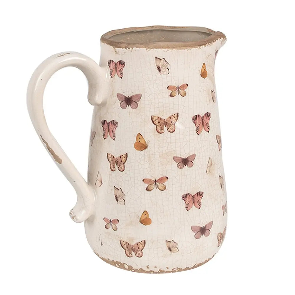 La décoration peut être de 21x15x23 cm de papillons en céramique rose beige verser la cruche Clayre & Eef.