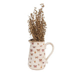 La décoration peut être de 21x15x23 cm de papillons en céramique rose beige verser la cruche Clayre & Eef.