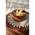 Le dessous de verre en coquille de raphia Bazar Bizar Living