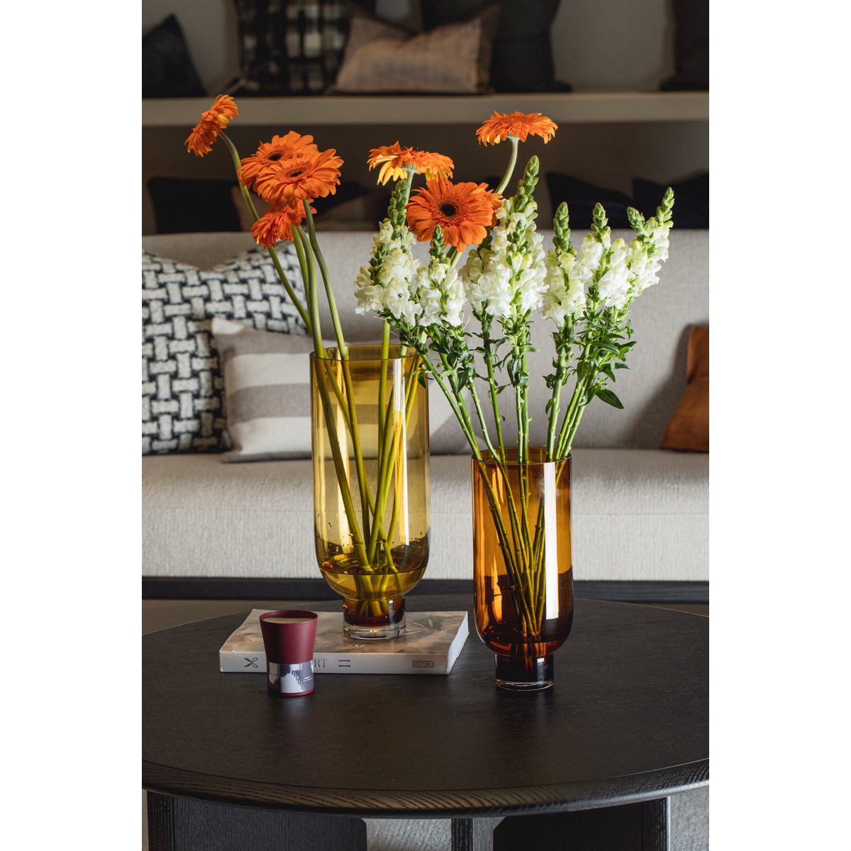 Modern, understated glass vase, cylindrical shape on a solid base, warm dark orange, OMAHA14AM